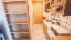 Deluxe Studio | Private kitchen - Modern And Comfy Studio (No Kitchen) At The City Square Apartment (Surabaya)