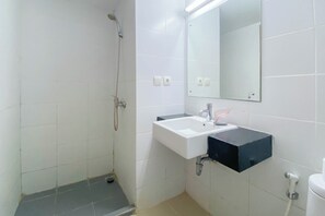 Deluxe Studio | Bathroom | Shower, towels - The Modern Studio Room At Beverly Dago Apartment (Bandung)