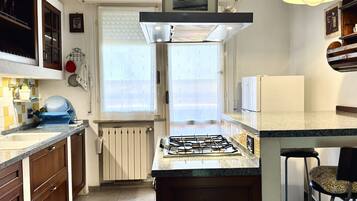 Fridge, oven, dishwasher, dining tables