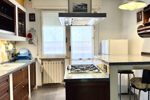 Fridge, oven, dishwasher, dining tables