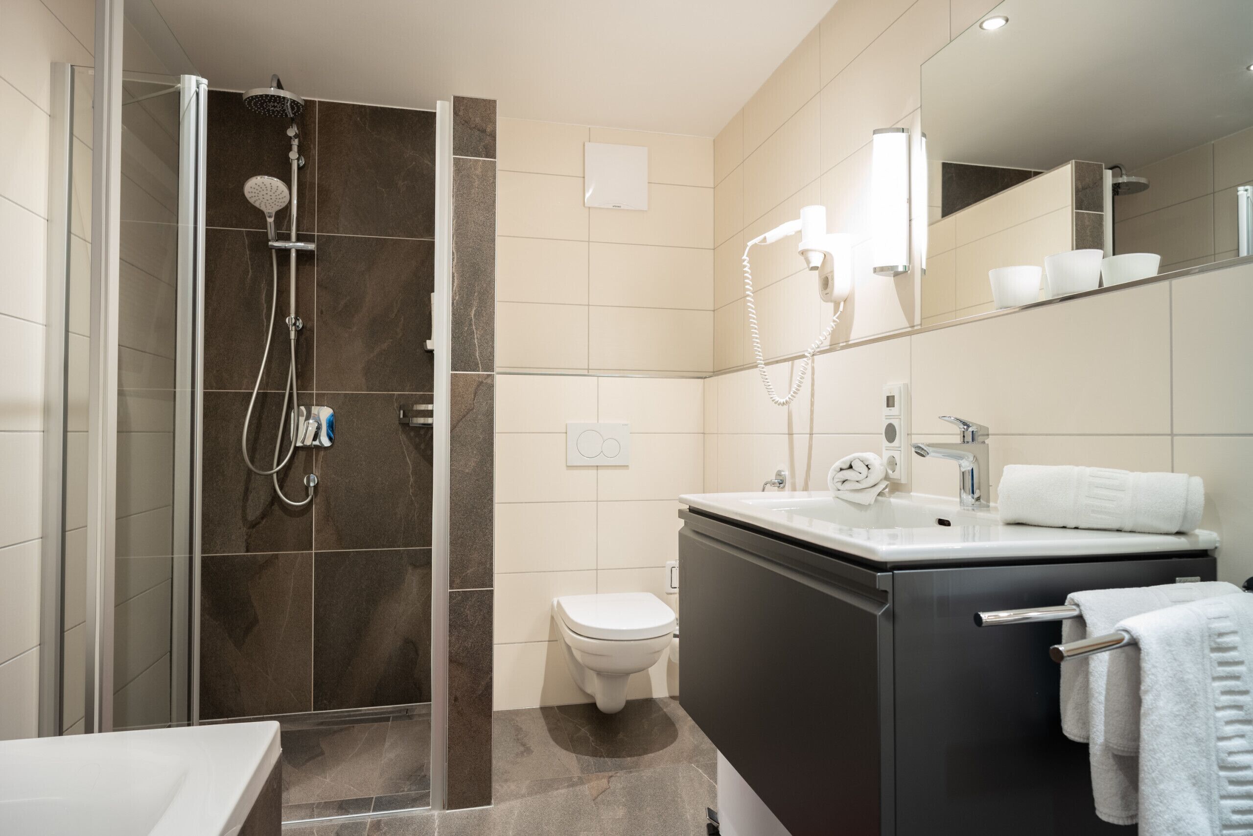 Shower, hair dryer, towels, soap