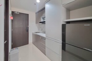 Deluxe Studio | Private kitchen | Full-sized fridge, stovetop - Homey And Scenic Studio At Patraland Amarta Apartment (Ngaglik)