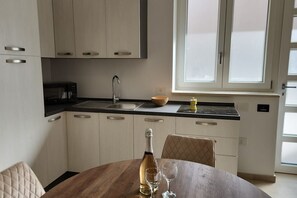 Fridge, microwave, stovetop, cookware/dishes/utensils
