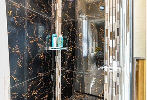 Shower, hair dryer, towels, soap
