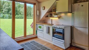A compact kitchen with a refrigerator, stove, and oven. - 1 bedroom awesome home in Västerlanda (Västerlanda)