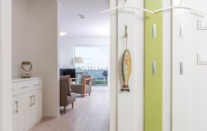 Enjoy a serene view from the large window, with a stylish wardrobe and decorative touches.