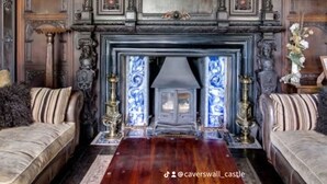 A grand room with a fireplace, ornate wood paneling, and a framed painting above it. - Caverswall Castle - Grade 1 Listed Historic Castle - Inquire for best quote now (Caverswall)