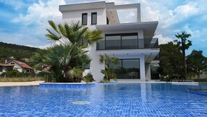 A modern two-story house with a swimming pool in front. - Vacation home Noel by Interhome (Imotski)
