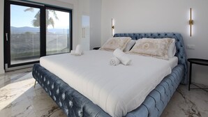 A spacious bedroom with a large bed, a sliding glass door leading to a balcony, and a modern design. - Vacation home Noel by Interhome (Imotski)