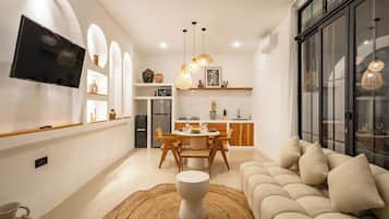 Deluxe Villa, Pool View | Living area | Netflix, streaming services