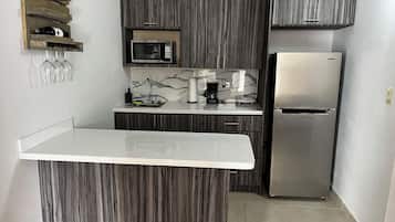 Fridge, microwave, coffee/tea maker, toaster