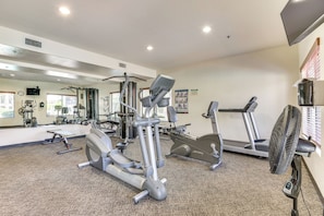 A gym with cardio machines, weight machines, and a fan. - ~ 1 Mi to Desert Ridge Marketplace: Phoenix Condo! (Phoenix)