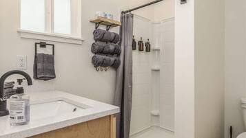 Shower, hair dryer, towels