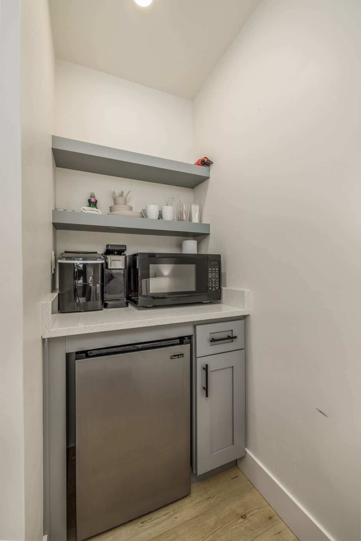 Microwave, coffee/tea maker, cookware/dishes/utensils, ice maker