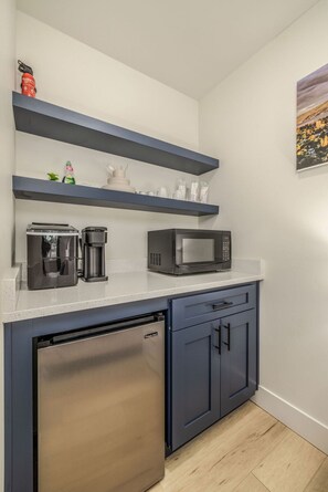 Microwave, coffee/tea maker, ice maker, dining tables