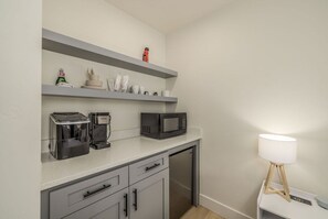Microwave, coffee/tea maker, ice maker, dining tables