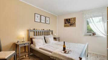 1 habitación, tabla de planchar con plancha, wifi gratis y ropa de cama