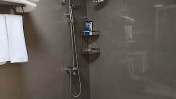 Shower, hair dryer, towels, shampoo