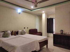Standard Room | Premium bedding, desk, laptop workspace, bed sheets - Hotel Manikanta (Guwahati)