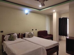 Standard Room | Premium bedding, desk, laptop workspace, bed sheets - Hotel Manikanta (Guwahati)
