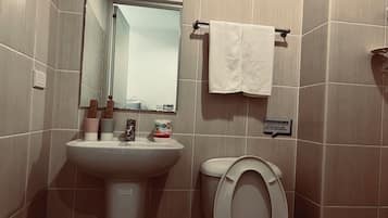 Shower, hair dryer, towels, shampoo