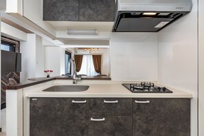 Comfort Apartment, Balcony, City View | Private kitchen | Electric kettle, toaster, rice cooker, eco-friendly cleaning products - SeRENO Shinmachi 801 (Osaka)