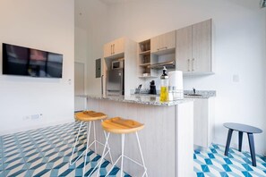 Fridge, microwave, stovetop, coffee/tea maker