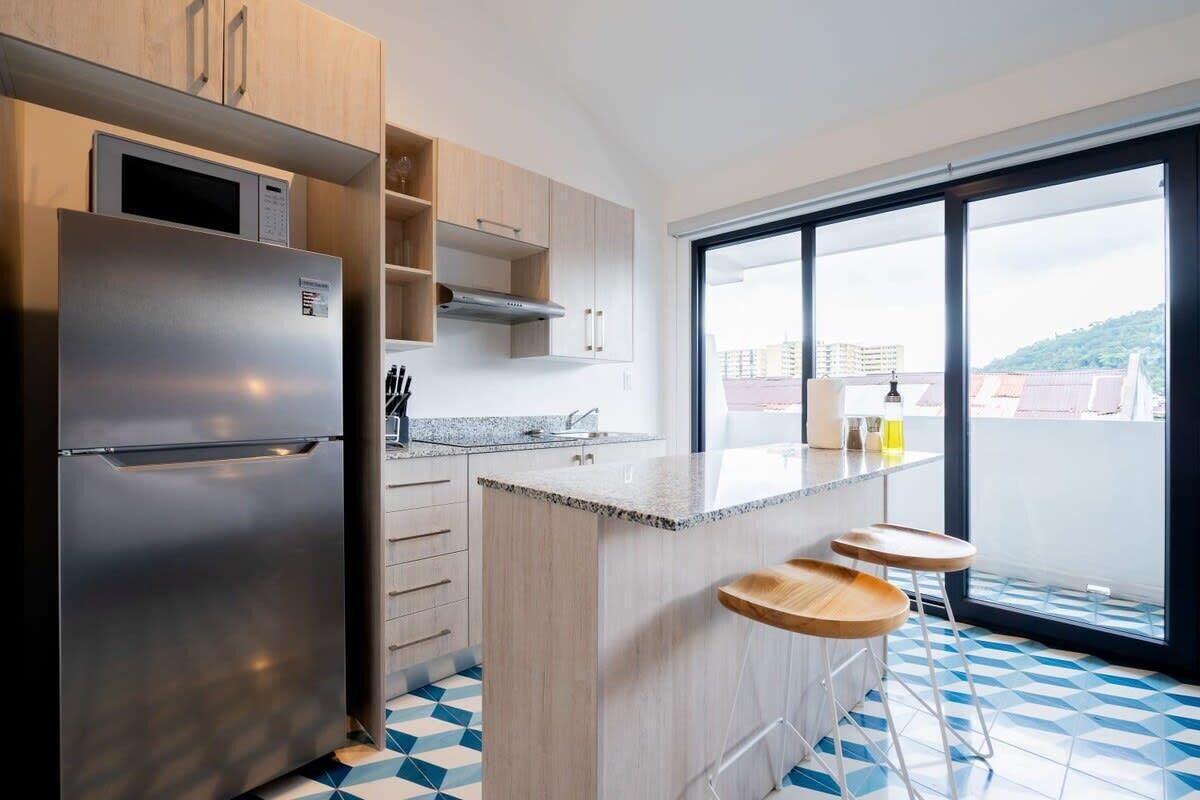 Fridge, microwave, stovetop, coffee/tea maker