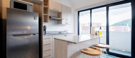 Fridge, microwave, stovetop, coffee/tea maker