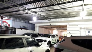 A parking garage with multiple cars parked in rows. - Gia Tu Hotel (Bien Hoa)