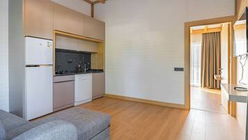 Family Apartment, Balcony, Garden View | Private kitchen | Coffee/tea maker, highchair