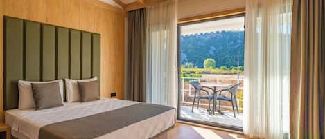 Family Apartment, Balcony, Garden View | Premium bedding, minibar, in-room safe, desk