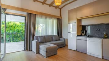 Family Apartment, Balcony, Garden View | Living area | 43-inch Smart TV with satellite channels, Netflix, streaming services