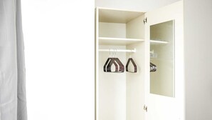 A white wardrobe with two hanging spaces and a mirror. - One Bedroom Flat in Gravesend Kent (Gravesend)