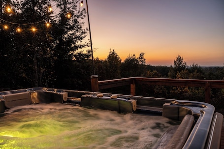 Outdoor spa tub. Secluded Mountain Getaway - 1 Cozy Tiny Home with SPECTACULAR views