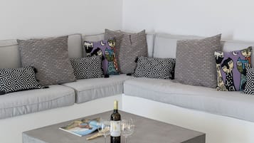 Casa Confort | Área de sala de estar | Televisión de pantalla plana