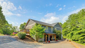 A two-story house with a porch, a covered entryway, and a driveway. - Walk to Downtown Weaverville: Quiet Apartment (Weaverville)