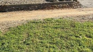 A two-story building with a balcony and a stone retaining wall. - Astonishing view 100 feet from the lake! (Sunrise Beach)