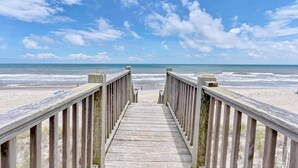 A wooden boardwalk leading to a beach with a clear sky. - Elegant Beach Villa: Pool, Hot Tub, Ocean Views (North Topsail Beach)