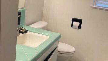 Hair dryer, towels, soap, shampoo