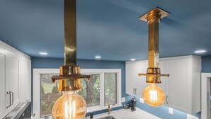 A kitchen with two pendant lights, a window, and a sink. - 2BR Historic Marblehead Home+Minutes to Beach (Marblehead)