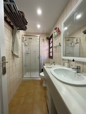 Shower, hair dryer, towels, soap