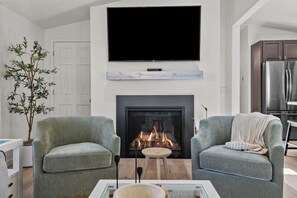 Smart TV, fireplace, books