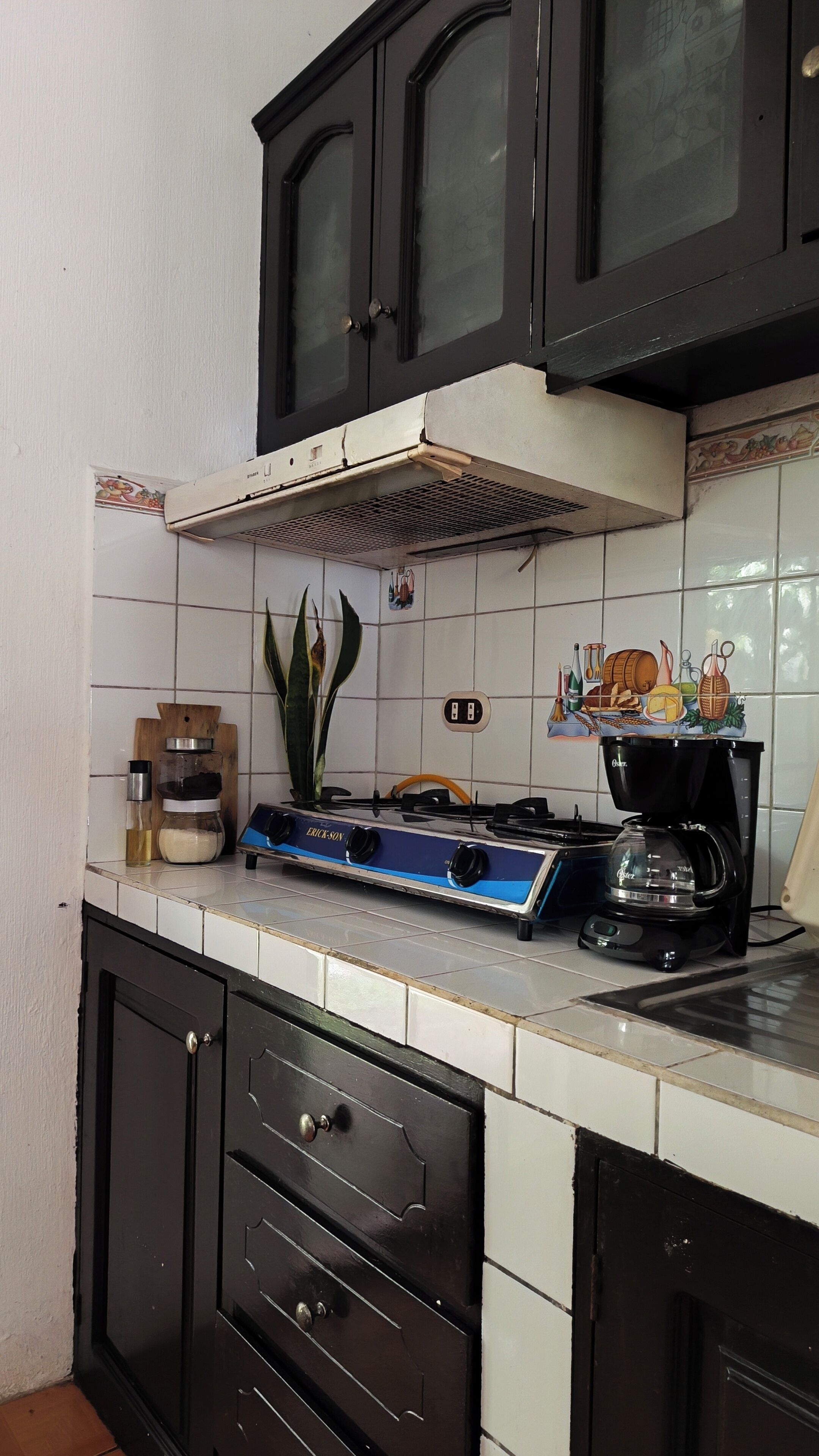 Fridge, microwave, coffee/tea maker, cookware/dishes/utensils