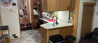 Enchanting camper-cabin life in small town Chapman Kansas with all amenities 