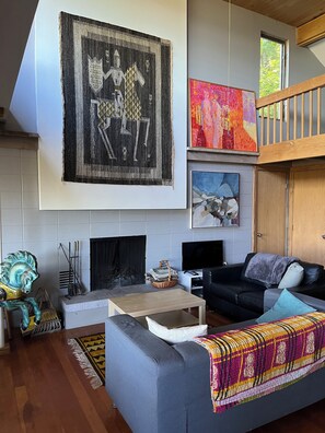 TV, fireplace, books - Your Vacation Starts Here: At The Cottage on Good Harbor Bay (Lake Leelanau)