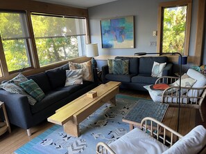 TV, fireplace, books - Your Vacation Starts Here: At The Cottage on Good Harbor Bay (Lake Leelanau)