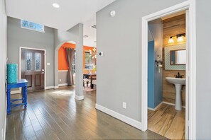 Cozy retreat with a modern design, featuring a comfortable chair and a stylish rug.