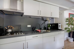 Fridge, microwave, stovetop, coffee/tea maker