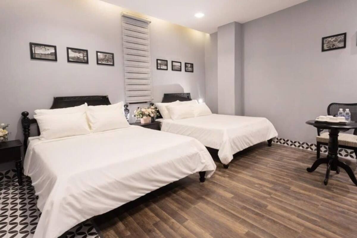 Deluxe Quadruple Room, 2 Queen Beds | Blackout curtains, soundproofing, iron/ironing board, free WiFi